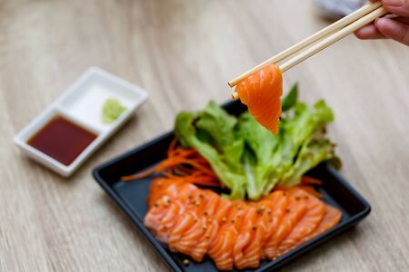 Raw salmon slice or salmon sashimi in Japanese style.の写真素材