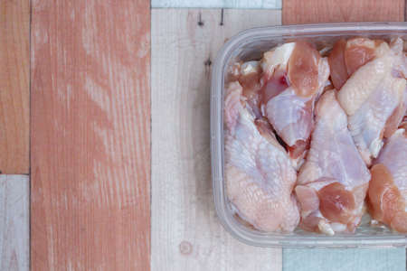 Raw chicken wings in a packageの写真素材