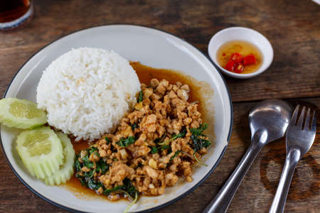 Minced pork basil with rice in Thai style.