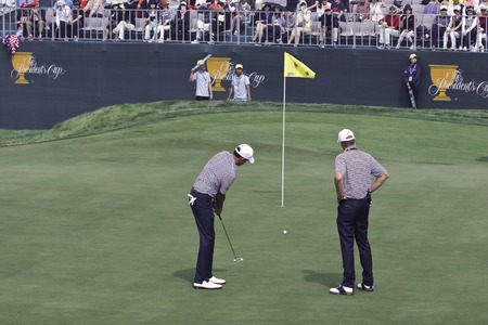 United States Team Players putting practice near 18th hole during the President Cup 2015 practice day two at Jack Nicklaus GC in Songdo, Incheon.のeditorial素材