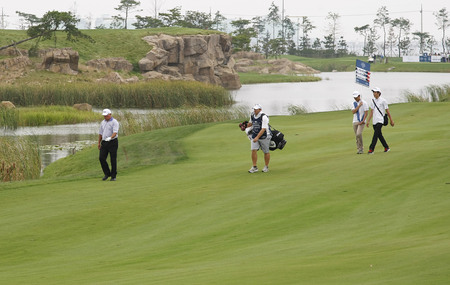 Mark O'Meara of USA (L) moving after 18th hall approach during the PGA Tour Songdo IBD championship second round at Jack Nicklaus golf club in Incheon, west of Seoul, on Sep 17, 2011, South Korea.のeditorial素材