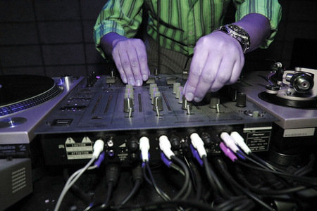 DJ turntable console mixer controllingのeditorial素材