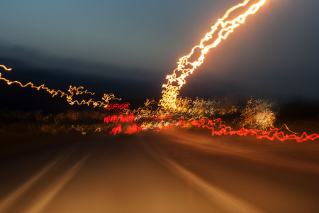 A colorful lighting show on the urban roadの写真素材