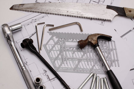 House build tool set on drawing background.