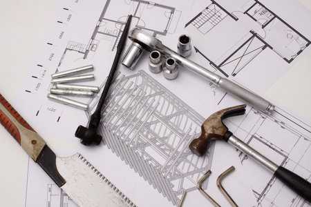 House build tool set on drawing background.