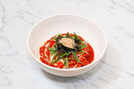 Korean Spicy Noodles on bright background.の写真素材
