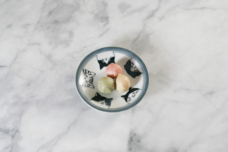 A three color Japanese fish cake decorated on the bright table.の写真素材