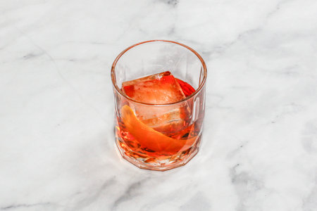 Cocktail Negroni decorated on the bright table.の写真素材