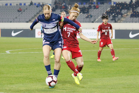 Nov 26, 2019-Yongin, South Korea-Natasha Dowie of Melbourne Victory and Lee Young Ju of Incheon Hyundai Steel Red Angels action during during an Women's Club Championship 2019-FIFA/AFC Pilot Tournamant Melbourne Victory V Incheon Hyundai Steel Red Angels のeditorial素材