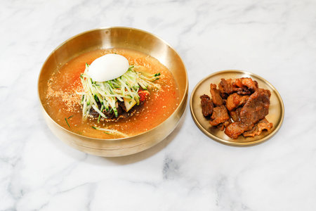 July 8, 2025-Sangju, South Korea-A Various styles Naengmyeon(Buckwheat cool noodles) decorated on...