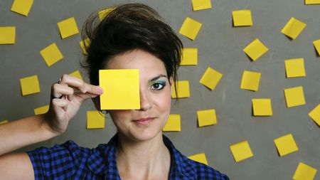 Pretty fashion model with hundreds of post it notes