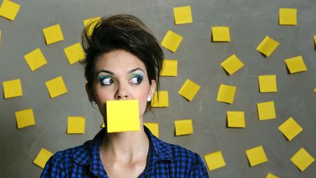 Pretty fashion model with hundreds of post it notes