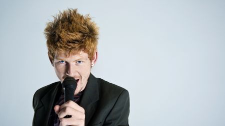 Super rock star lead singer belts out a high note