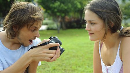 Gorgeous couple take pictures in the parkの写真素材