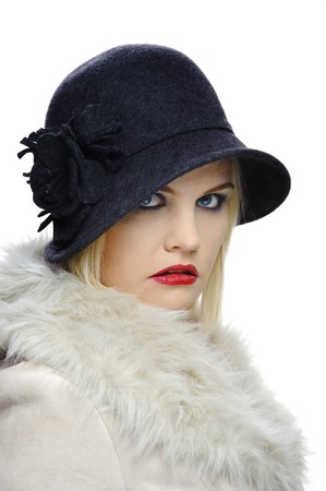 Beautiful woman poses for a portrait in her vintage hat