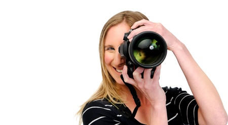 Happy woman practises her photography in the studio, isolated on white 