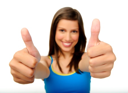 confident positive thinking young woman smiles and gives a thumbs up gestureの写真素材