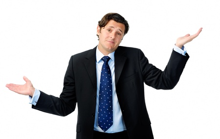 Unsure businessman shrugs his shoulders and throws his hands in the airの写真素材