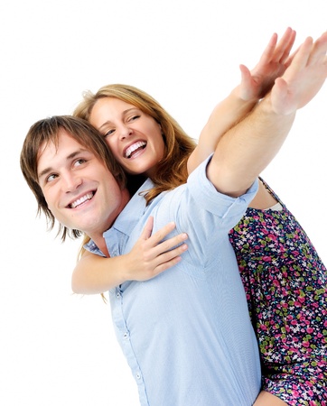 couple pretend they can fly with arms outstretched and big smiling facesの写真素材