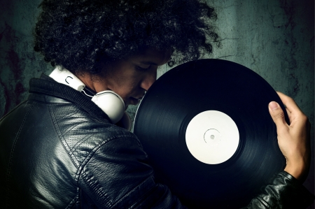 retro music dj portrait with old vinyl recordの写真素材