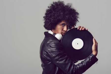 retro music dj portrait with old vinyl recordの写真素材