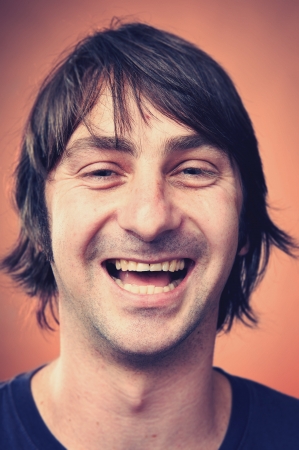 Smiling portrait face of real man with retro colour and high detailの写真素材