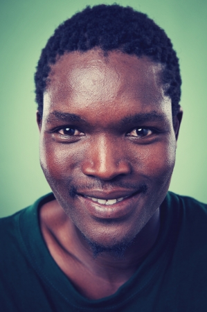 Smiling portrait face of real man with retro colour and high detailの写真素材