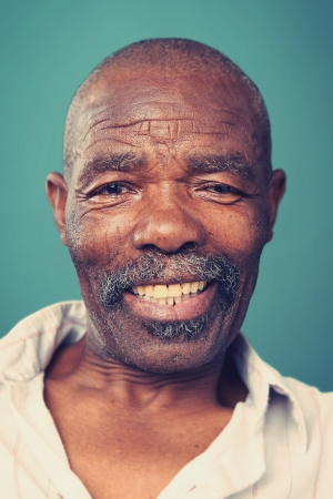 Smiling portrait face of real man with retro colour and high detailの写真素材