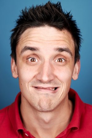 Comical funny face real man pulling silly expressionの写真素材