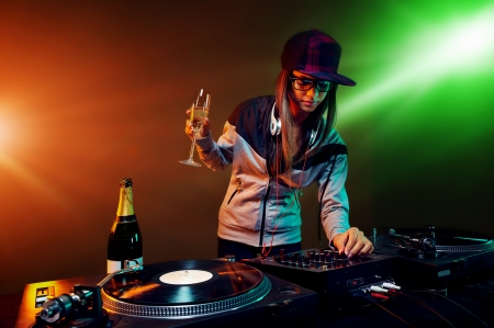 nightclub dj party with bubbly champagne and vinyl music playingの写真素材