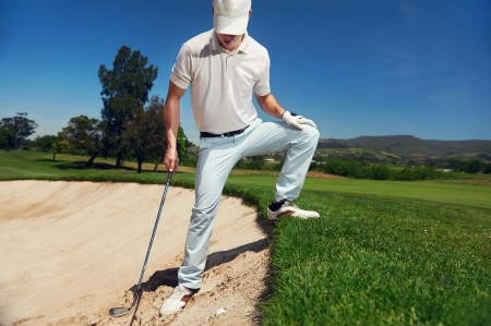 golf shot from sand bunker golfer hitting ball from hazardの写真素材