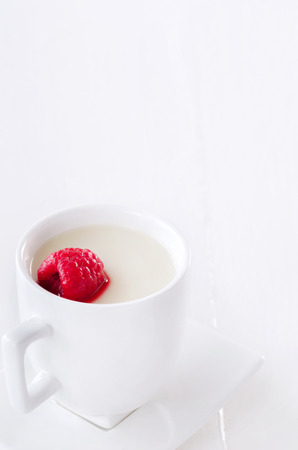 Panna cotta with stewed raspberry, traditional italian sweet dessertの写真素材