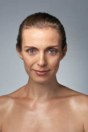 Bare natural portrait of beautiful mature middle age womanの写真素材