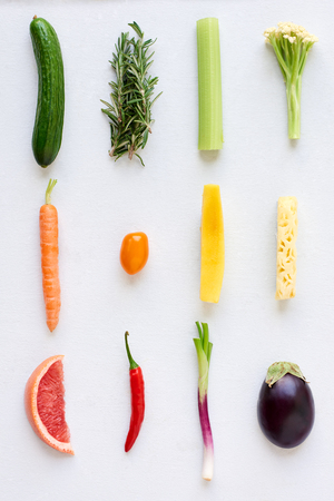 Artistic arrangement of fresh fruit and vegetables in colour gradient rainbow spectrum, interesting design food posterの写真素材