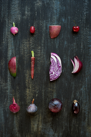 Gradient of purple colour tone fruit and vegetables from light to dark, artistic food poster of fresh produceの写真素材
