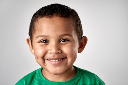 Mixed race boy smiling portrait child in studioの写真素材