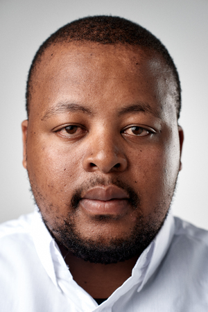 Portrait of real black african man with no expression ID or passport photo full collection of diverse face and expressionsの写真素材