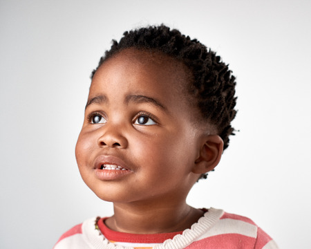 adorable black african girl portrait aspirational gazeの写真素材