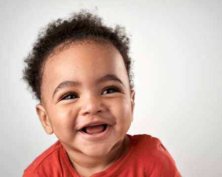 middle eastern arab baby boy portrait happy smiling and laughingの写真素材