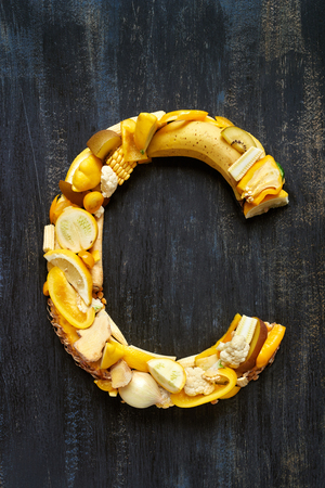 Complete set of fruit and vegetable alphabet letters in yellow concept for design layout and word spelling, see portfolio for other coloursの写真素材