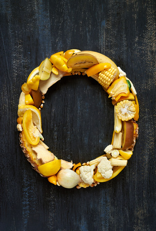 Letters formed by yellow fruit and vegetables, full series of alphabet in all colours in portfolioの写真素材