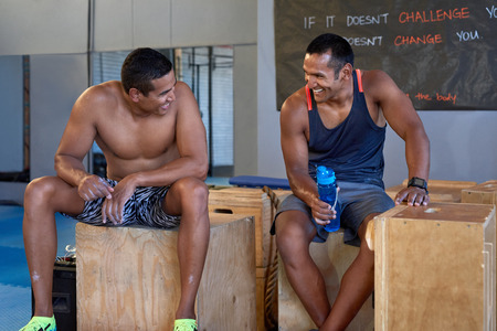 Gym buddies partners friends resting after their intense workout trainingの写真素材