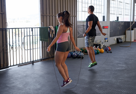 fitness cardio warmup with jump rope in industrial style gymの写真素材