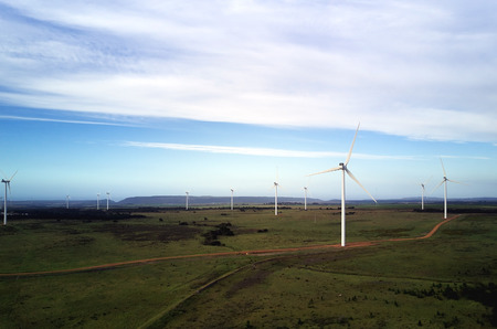 eco power wind energy farm against blue skies wispy clouds, future of sustainable energy innovative...