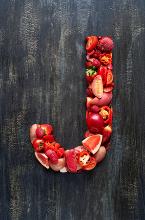 Vegetable letters formed from red fruits produce, overhead flatlay seriesの写真素材