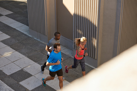 Exercising in the city, running jogging under bridges, urban landscapeの写真素材