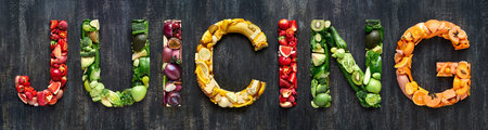 Flat lay collection of food words formed by fresh produce fruits and vegetables raw harvestの写真素材