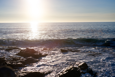 Sun setting on horizon, peaceful background travel aspirationの写真素材