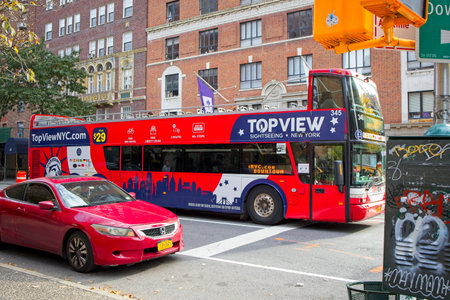 New York, NY, USA - Dec 20, 2020:  Tour bus on 5th Avenue with few passengers due to pandemic