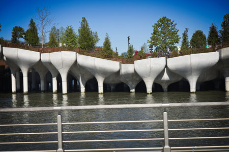 New York, NY, USA - May 15, 2021: Concrete pods, trees, plants, fencing for the new Little Island in Manhattanのeditorial素材
